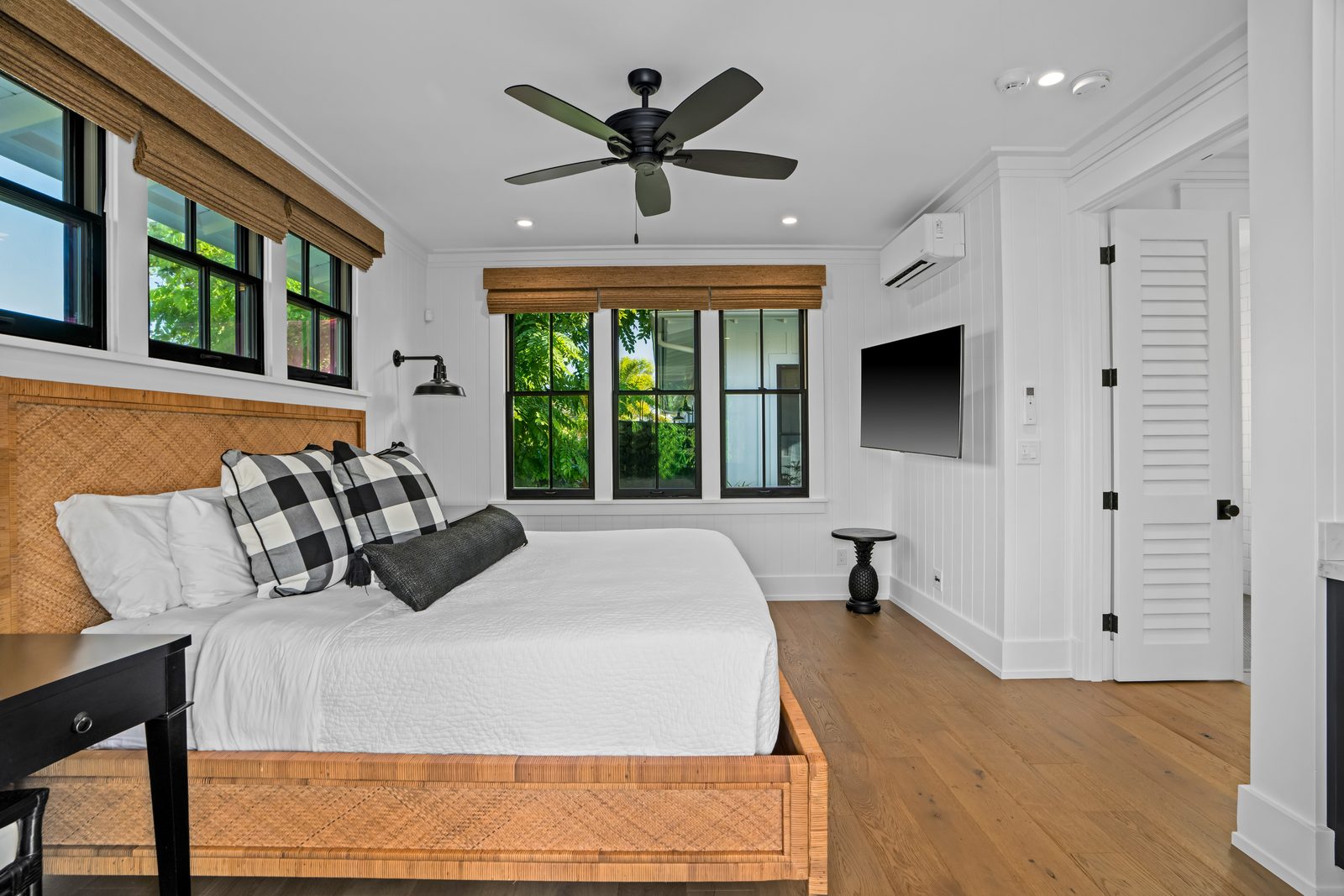 The Ohana bedroom from the other side, with shutters and a television