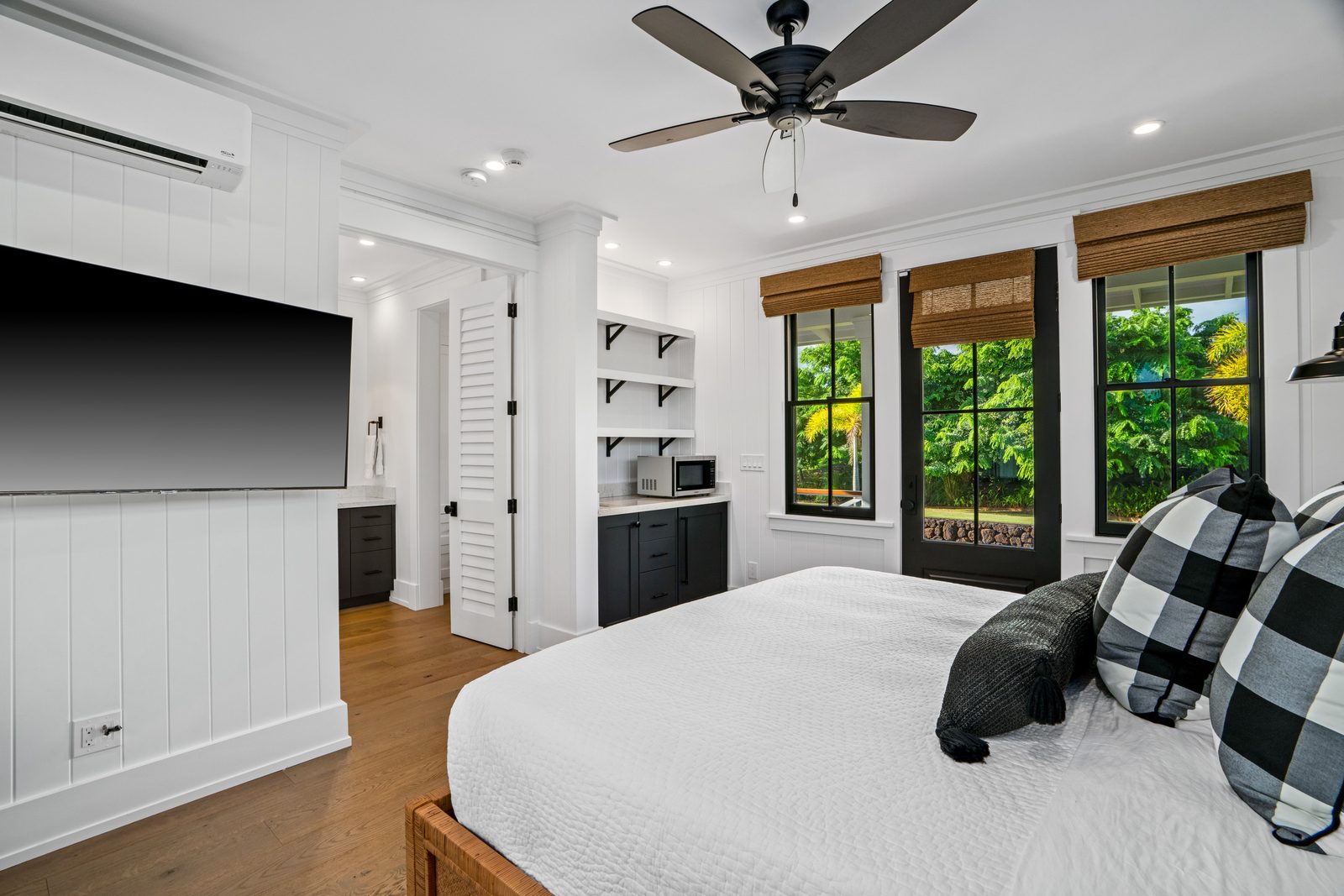 The Ohana bedroom showing its built-in shelving and kitchenette nook