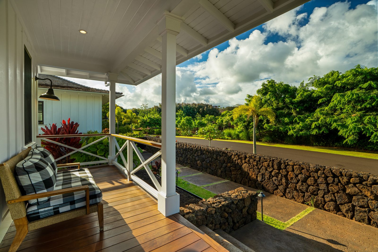 The Ohana Unit porch with cane chairs looking out over the country